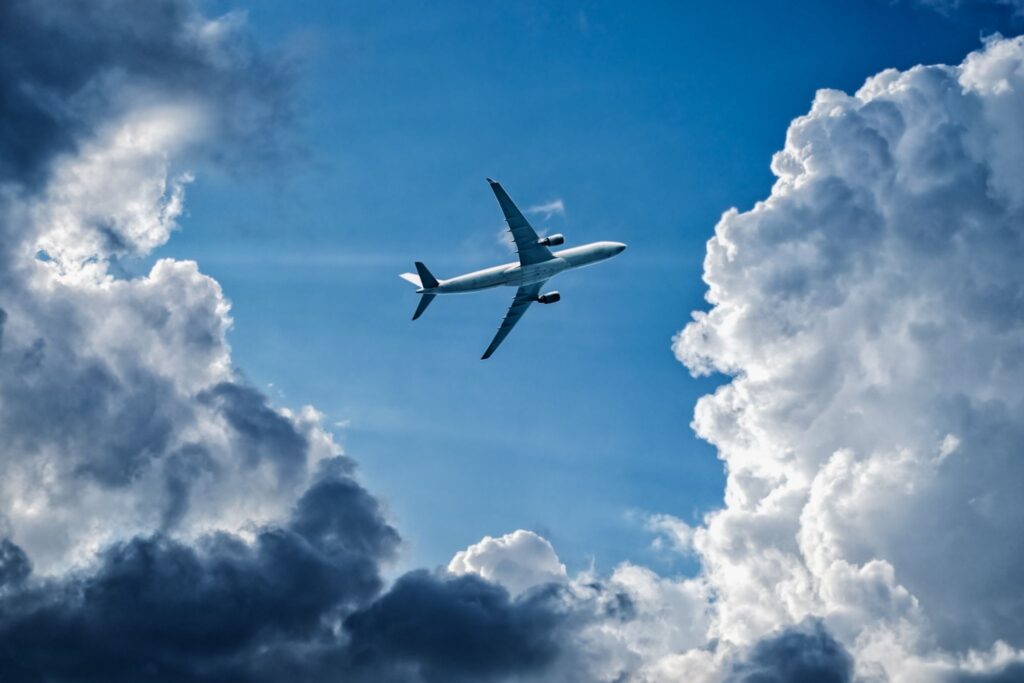 A plane flying through the sky.